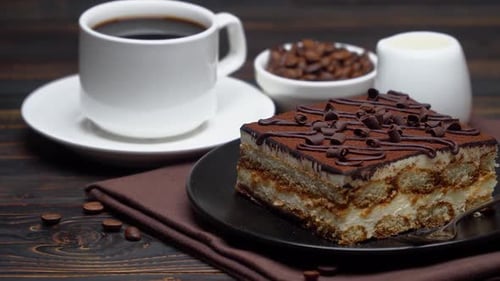 Tiramisu Cake and Black Coffee on Table
