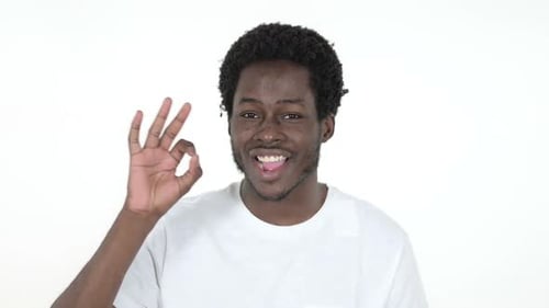 Young Man Smiles and Gives OK Sign