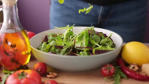 Preparing Fresh Green Salad with Vegetables at Home