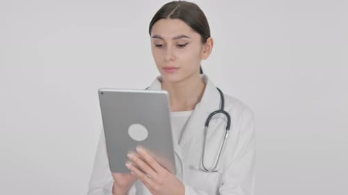 Young Doctor Uses Tablet in Hospital Setting