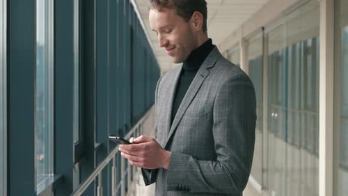 Young Adult Using Smartphone in Corporate Setting