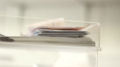 Stacks of Documents in Clear Tray