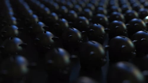 Gold Piggy Bank Among Black Ones