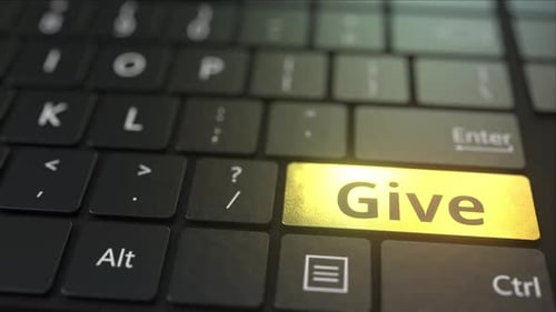 Black Computer Keyboard and Gold Give Key