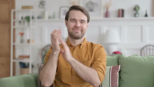 Young Adult Man Clapping Hands with Approval