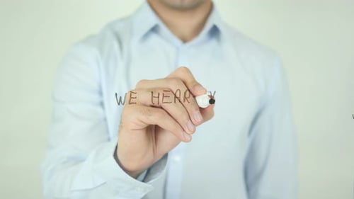 We Hear You, Man Writing on Screen