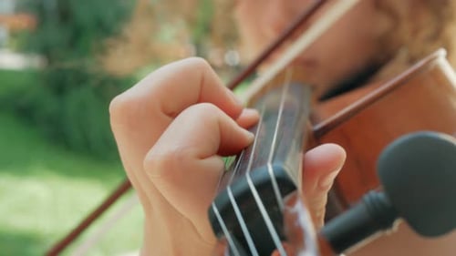 Close-up of the violinist: Musician playing violin classic music