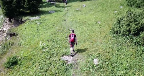 Man Hiking Mountain Trail with Backpack, Aerial View