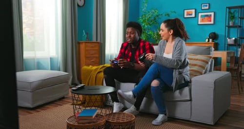 Friends Playing Video Game Together on Couch