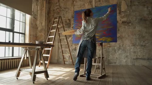 Female Artist Paints a Picture of Her Studio