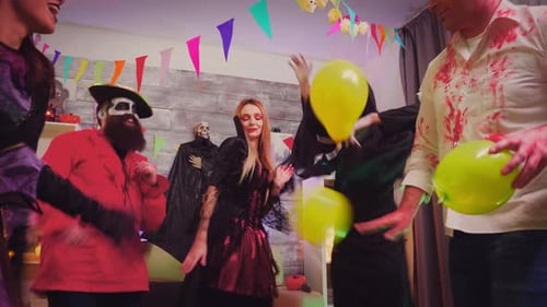 Adults Celebrating Halloween at Lively Costume Party