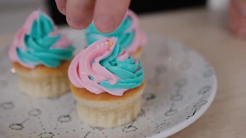 Decorating Adorable Cupcakes with Pink and Teal Frosting