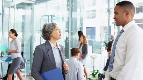 Businesspeople shaking hands in office