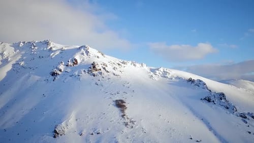 Aerial View of Snowy Mountains on Winter Day