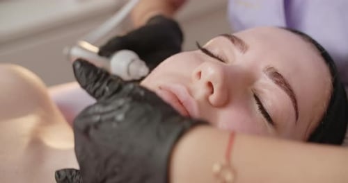 Facial Treatment with Microdermabrasion for Young Adult Woman
