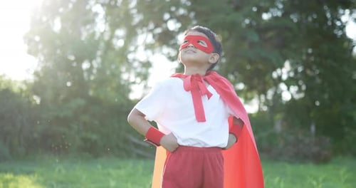 Hero boy in red at garden