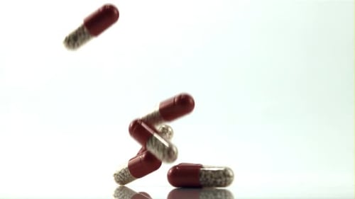 A Bunch of Pills Fall on the Table