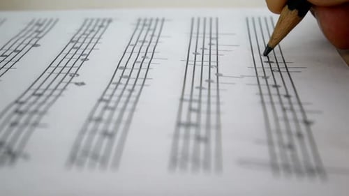 Close Up of Music Sheet Being Marked