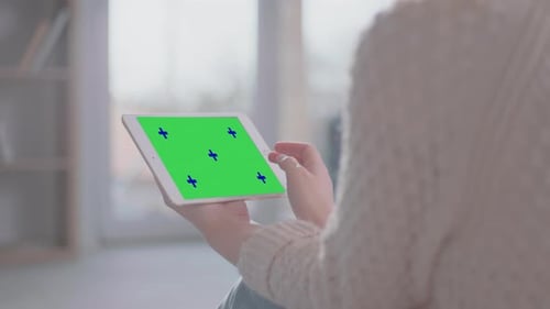 Adult Using Tablet with Chroma Key Screen