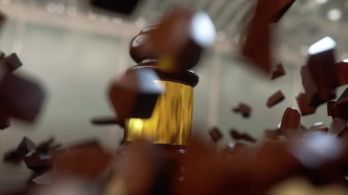 Golden Gavel Strikes Wooden Block with Shattering Impact