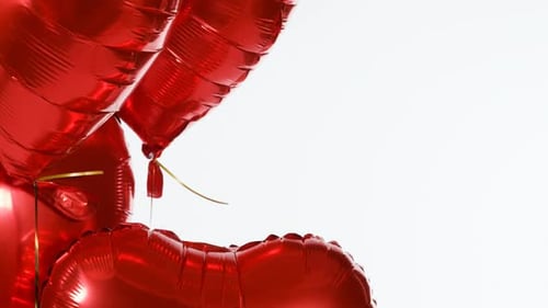 Festive Red Heart Balloons Floating