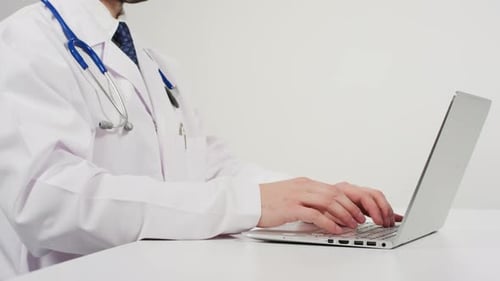 Doctor working on laptop