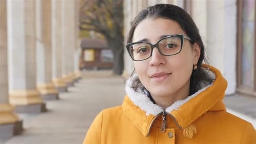 Attractive Woman Smiling in Urban Setting