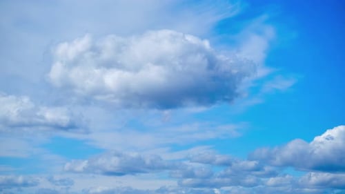 Cloudy blue sky gradually turns into dark rain clouds, time-lapse top view