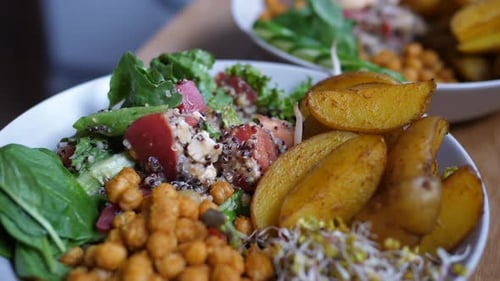 Close Up of Plate with Healthy Organic Vegan Homemade Food. Chickpea Salad Served with Potato Wings