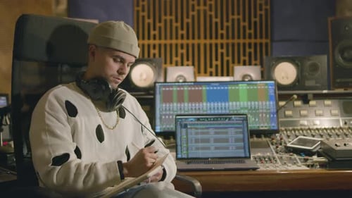 Young Caucasian Man Working at Music Recording Studio
