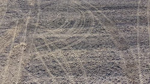 Textured Ground Surface with Marks and Patterns
