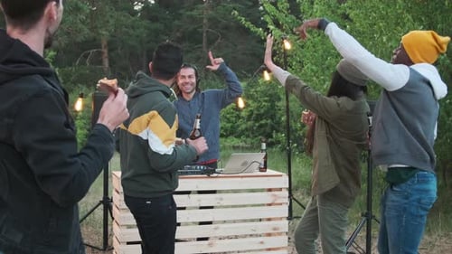 Friends Dancing and Celebrating at Outdoor Party