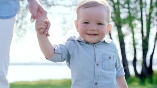 Cute Toddler Walking with Mum