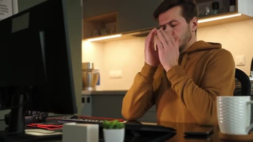 Man Works at Home Office Remotely Using Computer