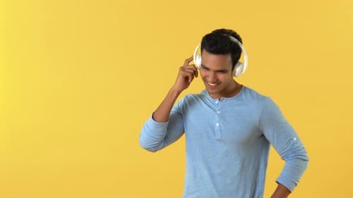 Man Dancing to Music With Headphones On