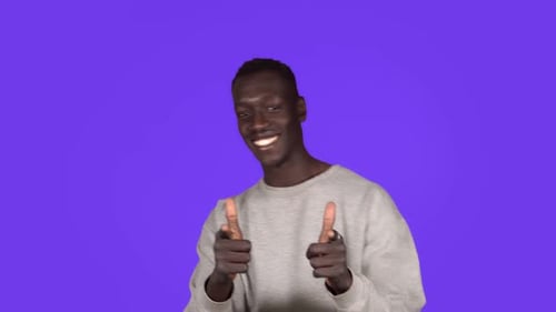 Smiling Man Dancing Happily on Purple Background