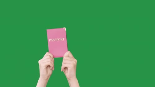 Hands Holding Passport with Chroma Key Background
