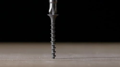 Drill Driving Screw into Surface Close Up