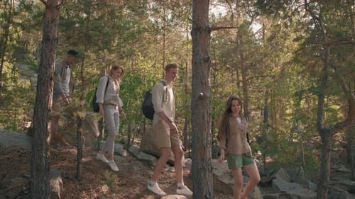 Slowmo of Young Friends Hiking in Woods