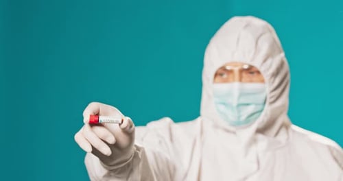 Paramedic Physician Secured in Protective Clothing Medical Uniform Isolated From Virus Coronavirus