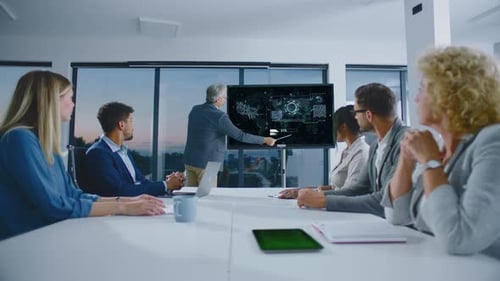 Business Professionals Meeting Discussing Technology in Conference Room