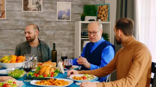 Gathered Friends and Family Celebrating Meal