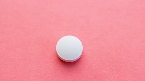 Different Pills Sequence. Stopmotion of Few Different Pills on Pink Background