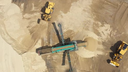 Aerial view loading bulldozer in open air quarry. Sand mining industry. Bulldozer machine. Crawler b
