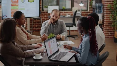 Diverse Team Meeting in Modern Office