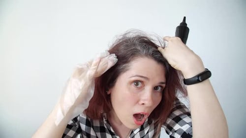 Woman Applies Hair Dye at Home, Surprised
