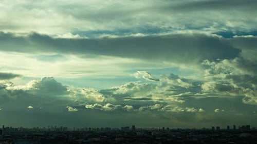 Time lapse beautiful twilight fluffy storm cloudy blue sky in cityscape