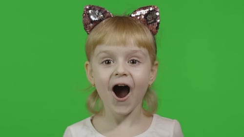 Excited Child with Cat Ears on Green Screen