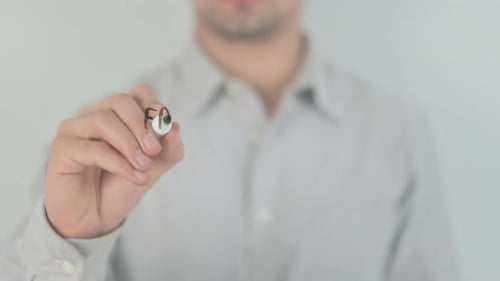 Man Writes Freelance Jobs on Clear Surface