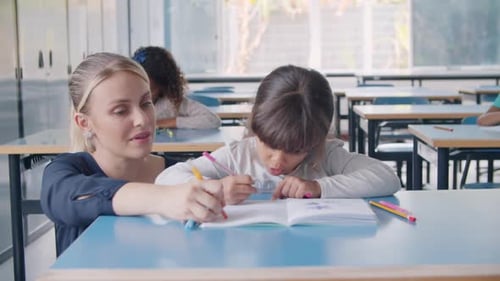Primary School Teacher Showing and Explaining Task